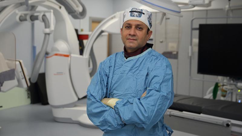 Surgeon standing in operating theatre 