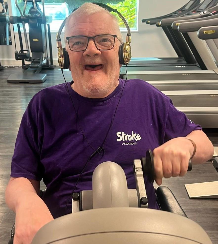 Stroke survivor Donald Law on a rowing machine