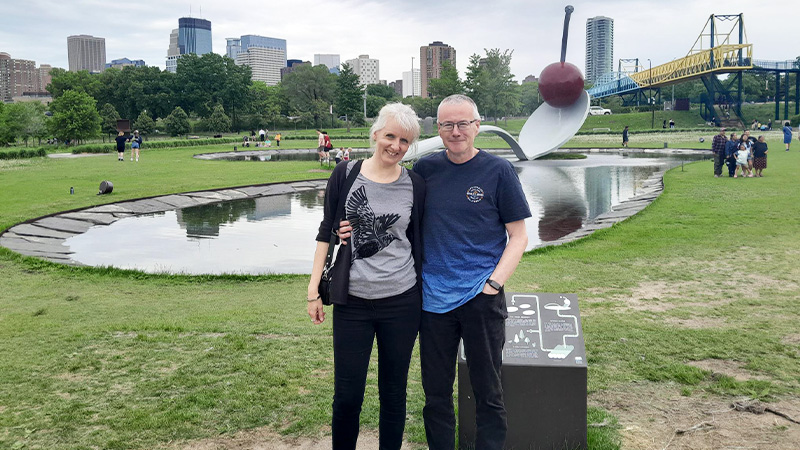 Photo of Emilia and Guy in a park.