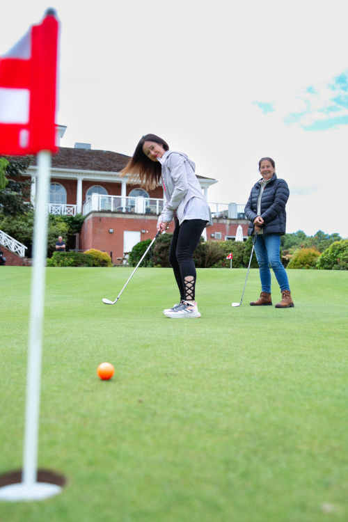 woman playing golf