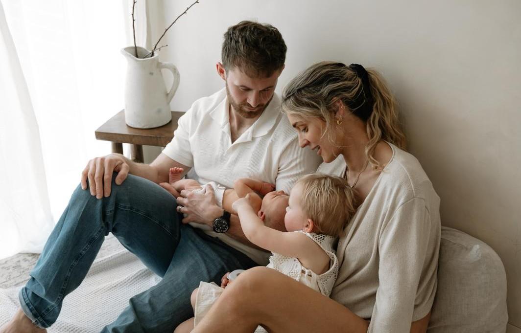 A young couple with two small children