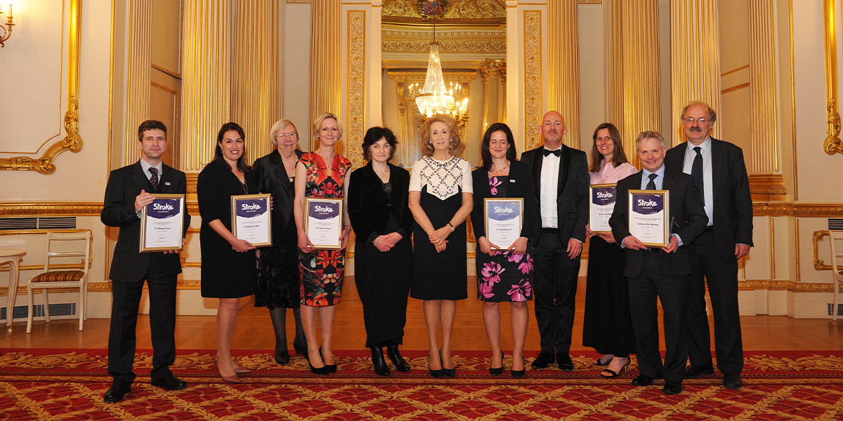 The keynote 2016 award winners holding their awards and standing in a line.