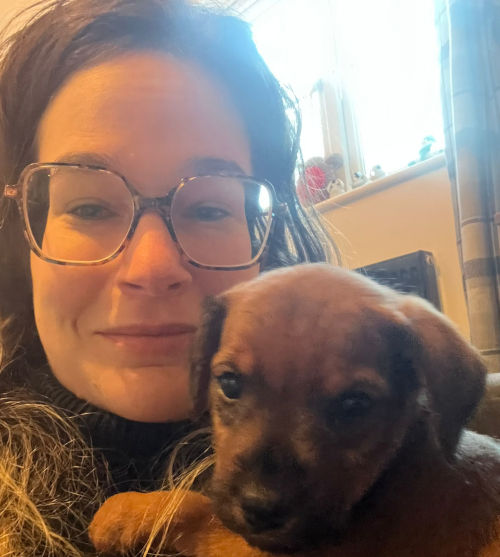 A woman and her puppy.