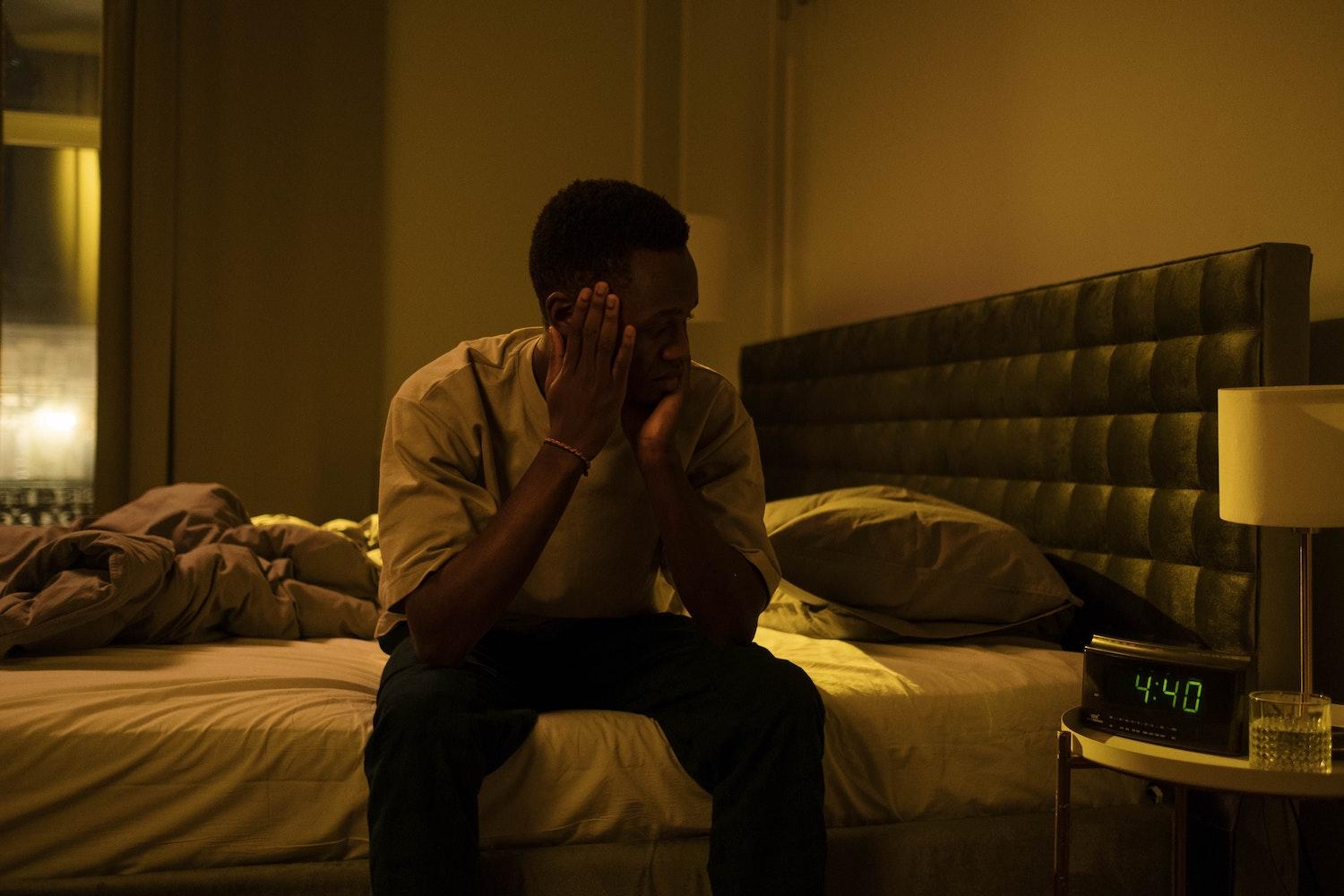 man sat up in bed