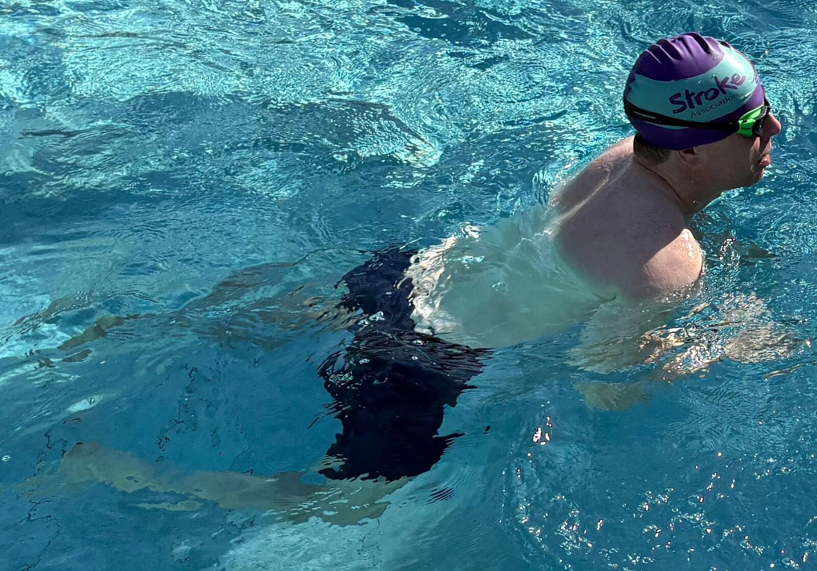 Matt swimming in a pool