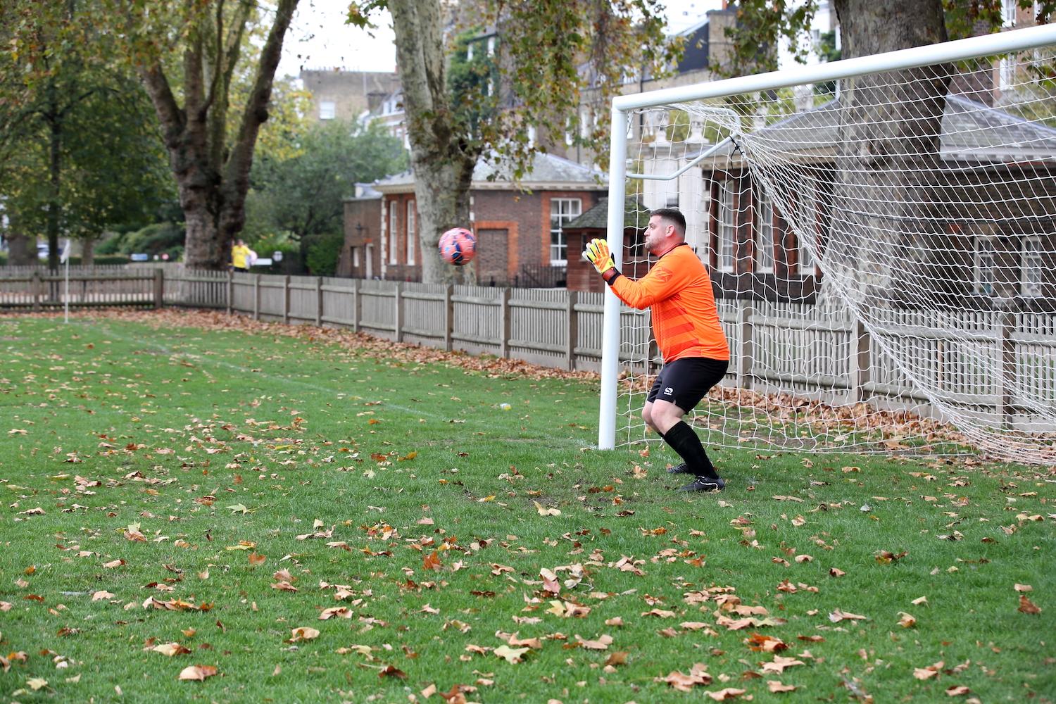 Image of man catching football in goal