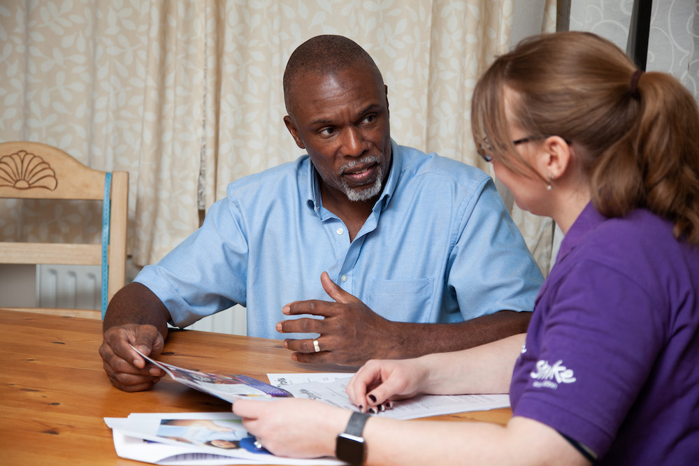 Baz talking to a Stroke Association staff member