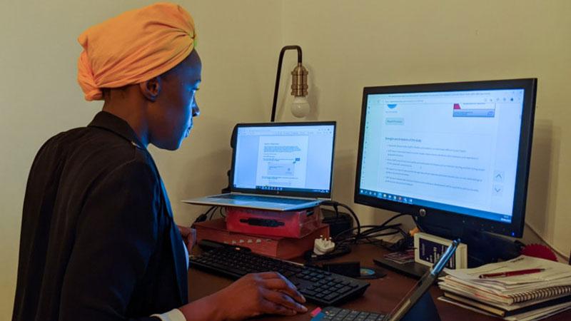 Researcher Emily working on computer