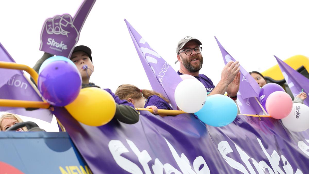 Stroke Association supporters at the Great North Run with balloons and flags