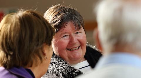 A woman smiling towards the camera