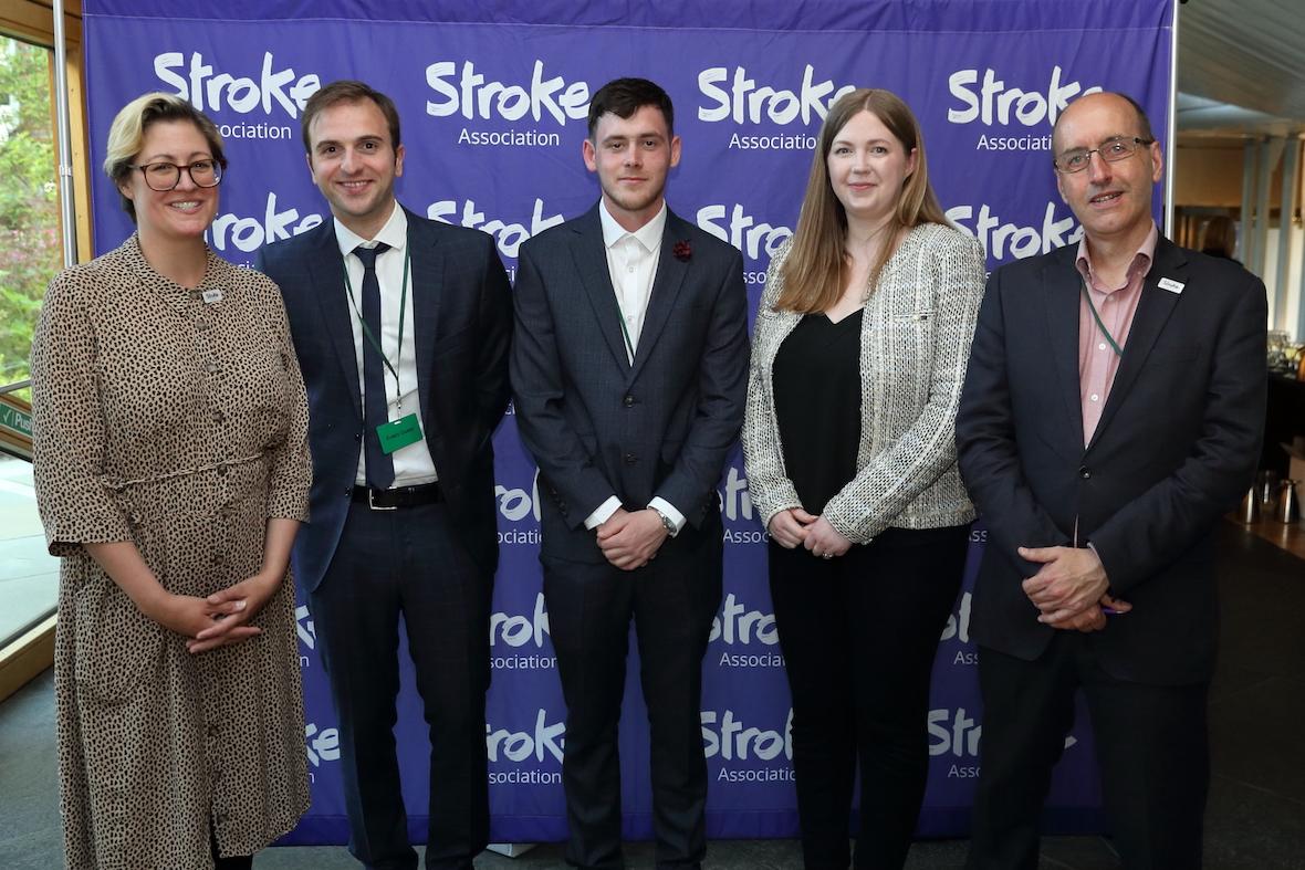 Alexis Kolodzeij and John Watson with three others at a Parliamentary Reception on Thrombectomy in Edinburgh.