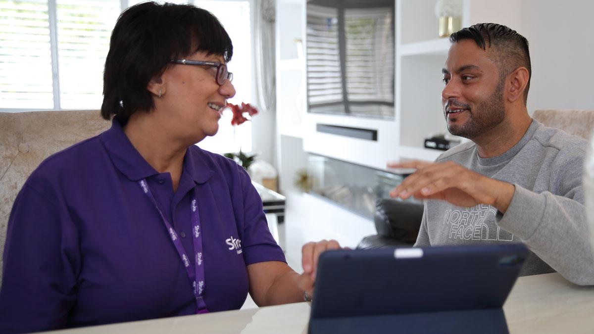 Stroke surrvivor Marwar with a member of the Stroke Association