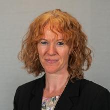 Katherine Staley, a ginger woman smiling at the camera