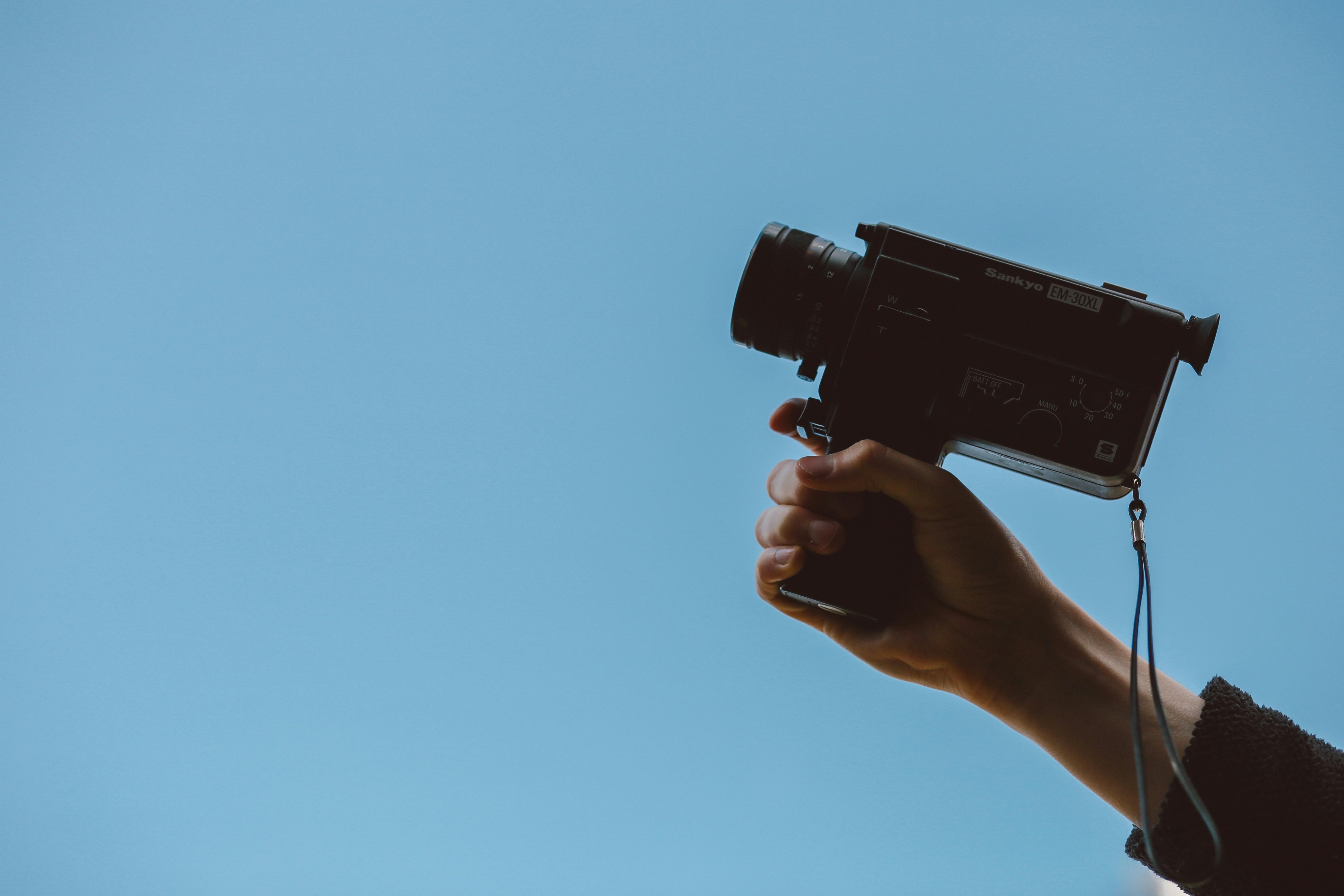 Image of person holding a camera