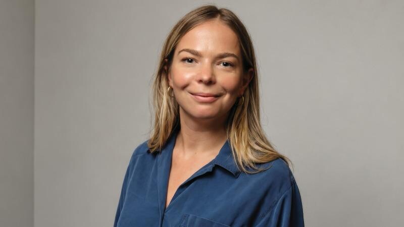Stroke researcher, Triin, stands smiling for the camera. 