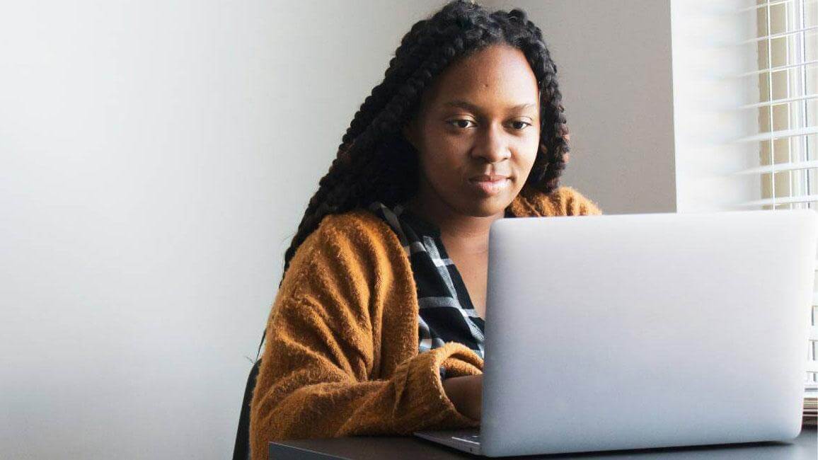 Woman at desk with laptop