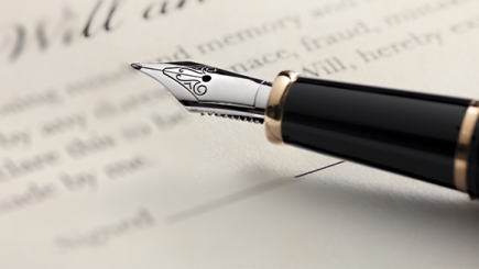Fountain pen on top of official looking papers