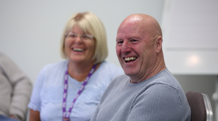 Photo of two delegates at the Stroke Group Network Conference, laughing