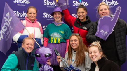 Photo of seven people at a cheerpoint