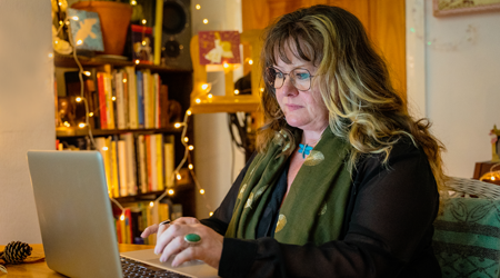 Photo of Sarah at her computer