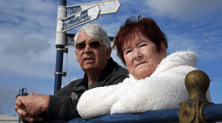 Anne and Barry, outside, looking into the distance
