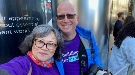 Photo of two volunteers at a sporting event