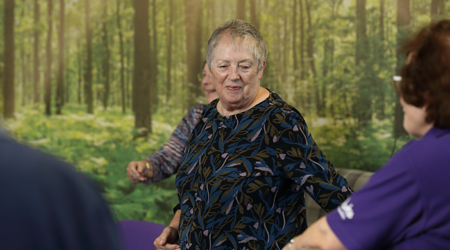 Photo of a stroke survivor dancing at a stroke group meeting