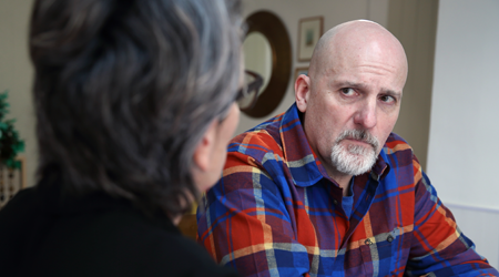 Photo of Clive, a stroke survivor, speaking to a Communication Support Coordinator.