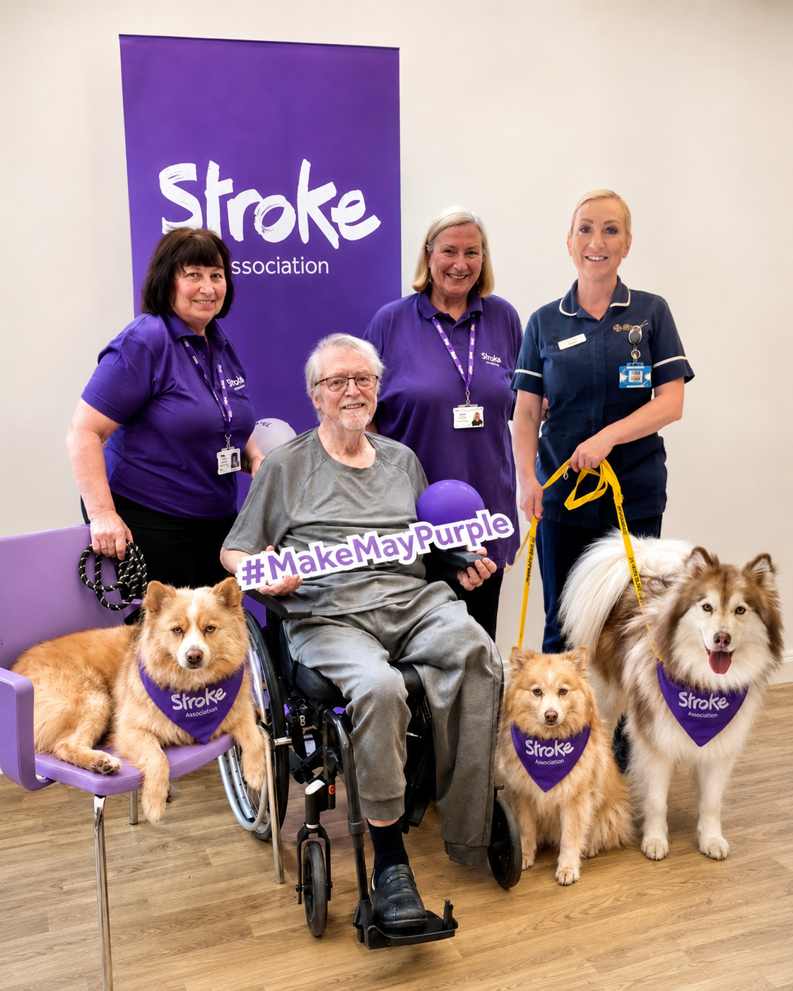 Coordinator Jacquelyn and volunteer Rita with her three therapy dogs visiting patients at Colwyn Bay Hospital