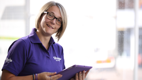 Stroke survivor Claire using an iPad   