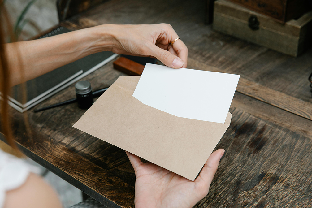 Person opening envelope
